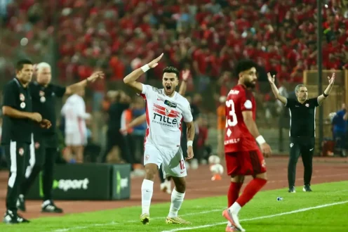 شعار نادي الزمالك مع صافرة حكم، يرمز لتصعيد الزمالك ضد التحكيم